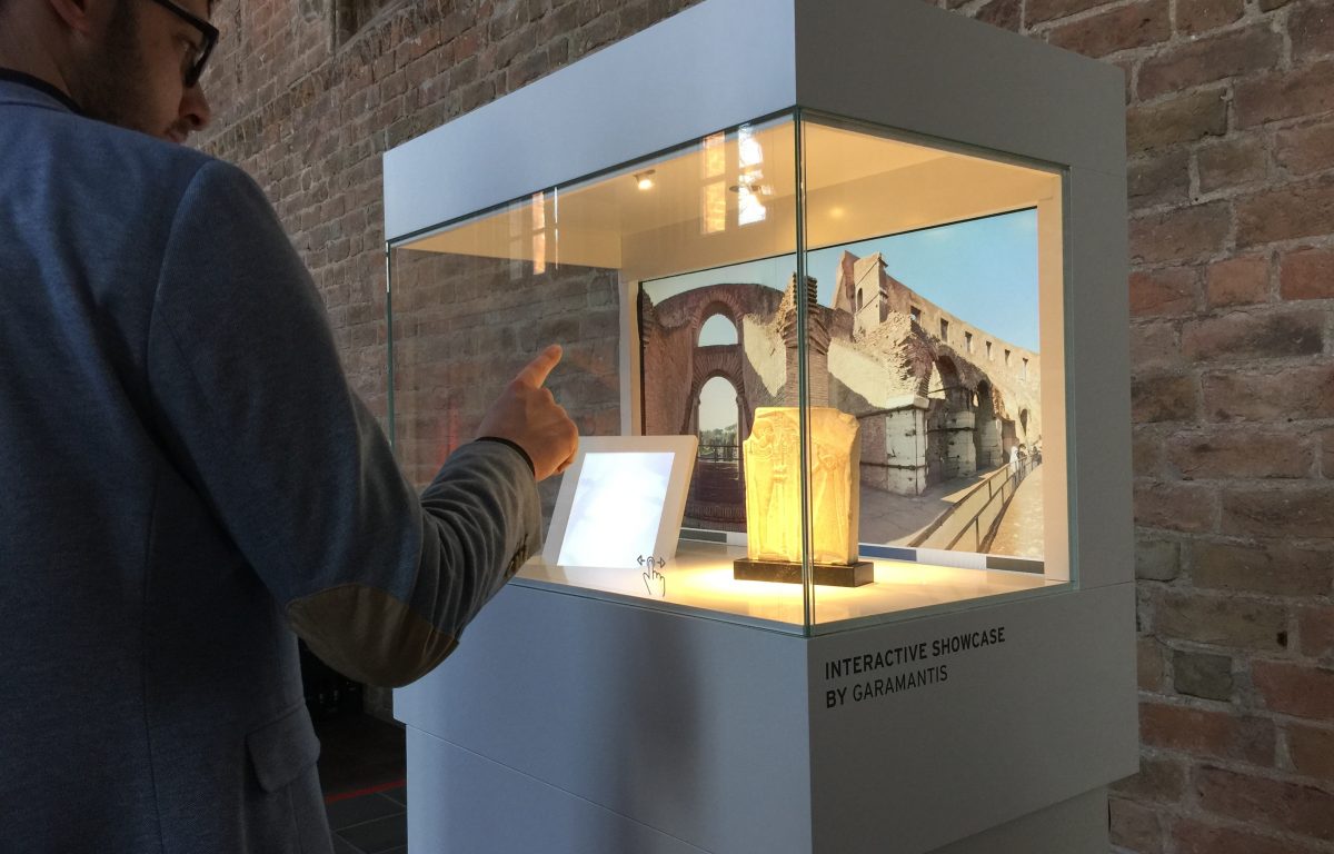 User interacts with the museum showcase
