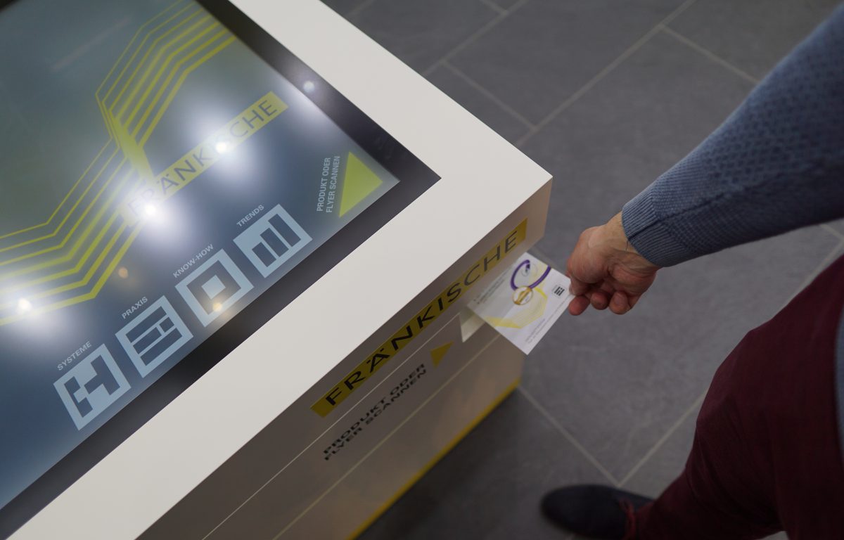 Optical object recognition scans flyers at the trade show booth