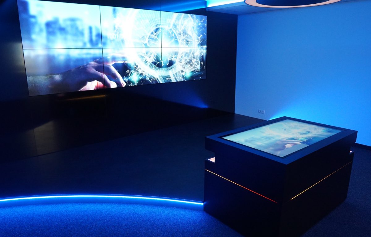 Interactive showroom with multi-touch table and screen wall